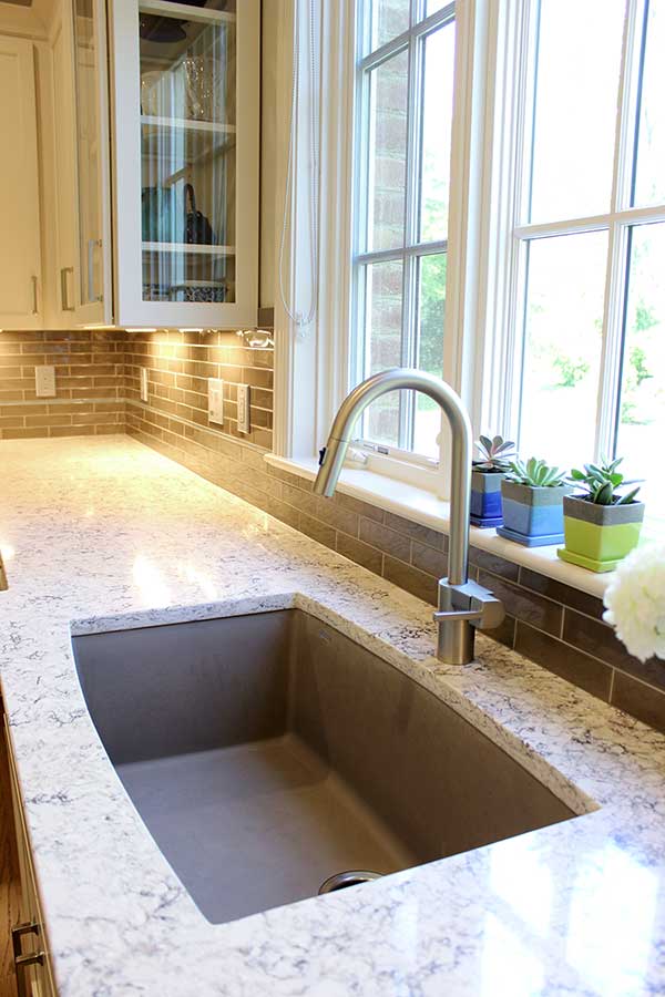 After - New Quartz Countertop and Elongated Subway Tile Backsplash