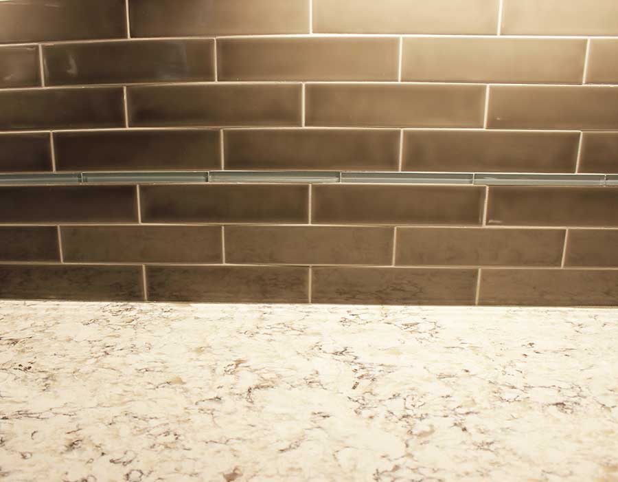 After - Quartz Countertops and Elongated Subway Tile Backsplash